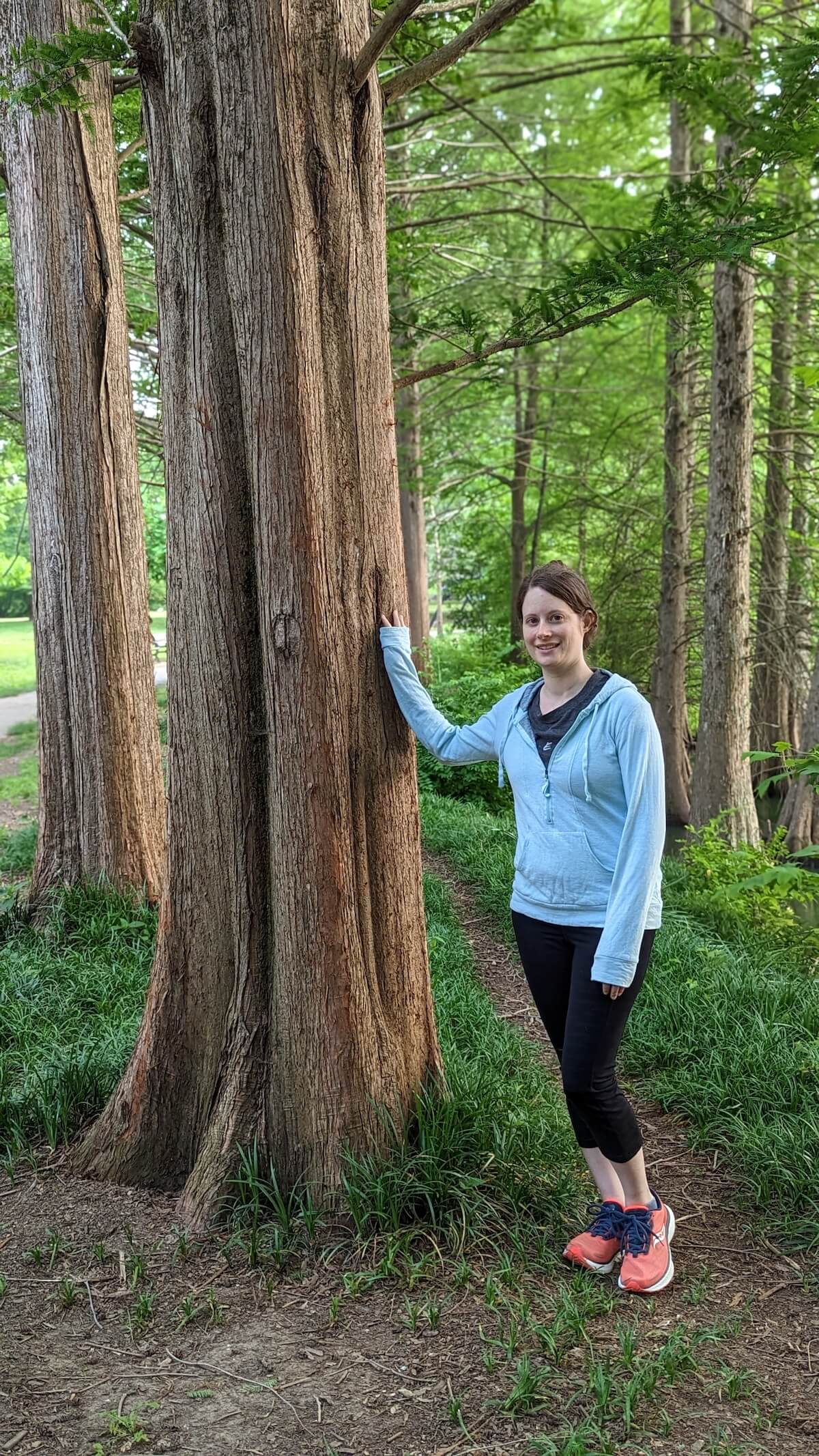 Marita outdoors among the trees